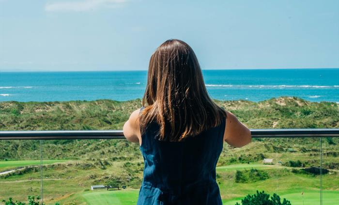 Many rooms have balconies overlooking the sea